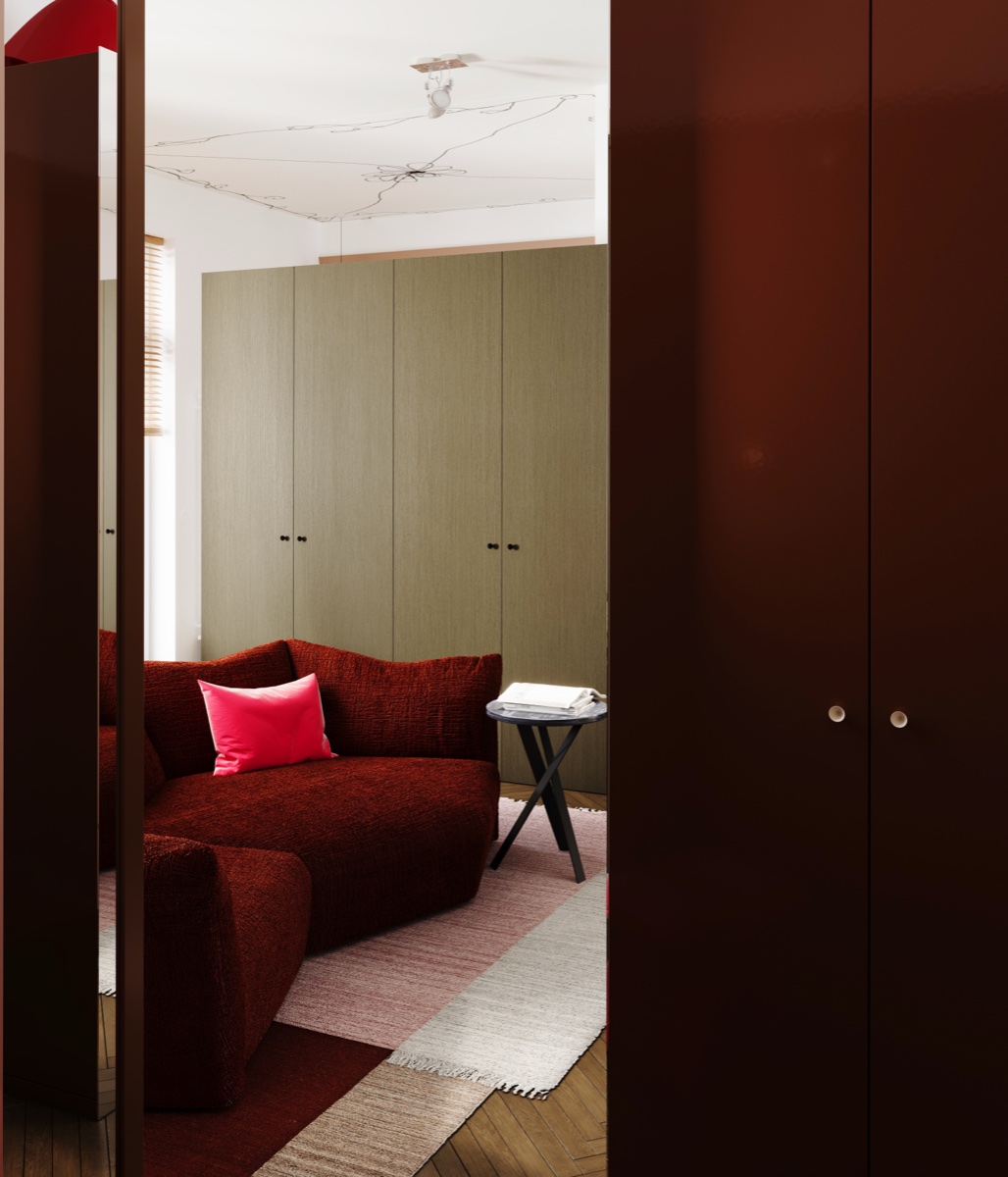 Garderoba z burgundowym fotelem i oliwkowymi akcentami